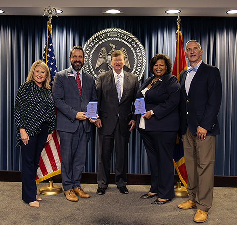 photo of award recipients with governor and MSPB representatives