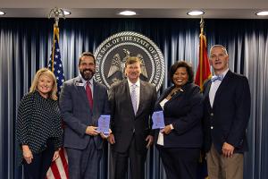 photo of award recipients with governor and MSPB representatives